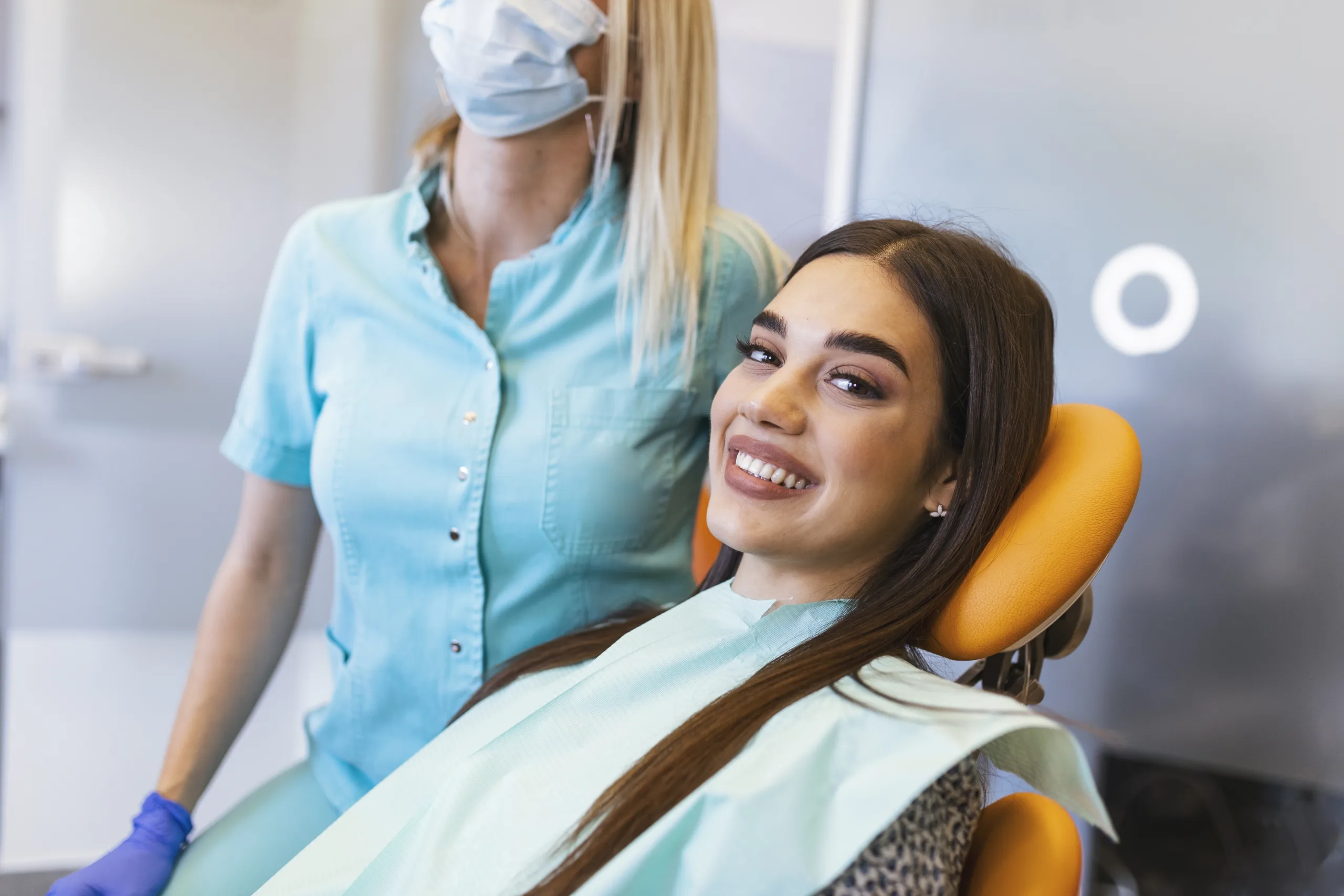 Patient sitting in chair smiling